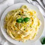 Creamy lemon ricotta pasta recipe with fresh basil and lemon garnish.