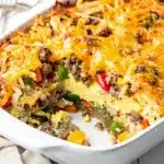 Crockpot hashbrown breakfast bake casserole with sausage, cheese, eggs, and peppers.