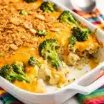 Creamy crockpot hashbrown casserole with broccoli and cheesy cracker topping.