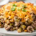 Creamy crockpot hashbrown casserole with green chiles and melted cheese.
