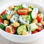 Creamy cucumber chickpea salad recipe with crisp vegetables and glossy dressing
