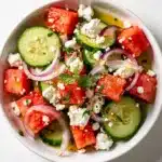 Refreshing cucumber watermelon salad with feta mint and lime honey dressing