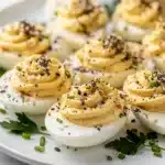 Everything bagel deviled eggs with creamy filling and seasoned topping.