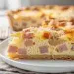 Easy ham and cheese quiche recipe with flaky golden crust and creamy filling