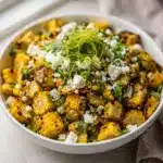 Creamy Mexican street corn salad with cotija cheese and fresh cilantro.