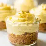 No bake lemon cheesecake cups with creamy filling and crumb crust.