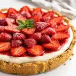 No bake strawberry pie with creamy filling and fresh berries on graham crust