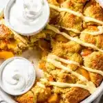 Warm peach cobbler with vanilla drizzle and creamy Greek yogurt.