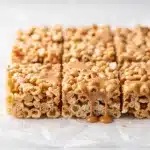 Peanut Butter Rice Krispie Treats square with a crisp golden edge and glossy swirls.