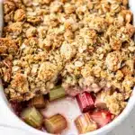 Rhubarb crisp with a sweet oat topping baked until golden and bubbling.