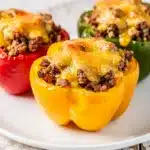 Savory ground beef stuffed bell peppers topped with melted cheddar cheese.
