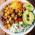 Quick turkey taco skillet with ground meat beans corn rice and fresh toppings
