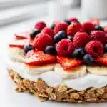 Banana split breakfast bar with yogurt, fruit, and oat crumble topping.