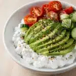Creamy cottage cheese bowl with tomatoes cucumber avocado seasoning
