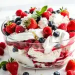 Overhead view of Eton Mess dessert with fresh berries and whipped cream.