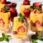 Homemade frozen fruit bars with mint and berries closeup
