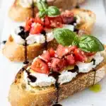 Creamy goat cheese bruschetta with tomatoes basil balsamic glaze