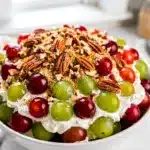 Creamy grape salad dessert with crunchy brown sugar pecan streusel topping.