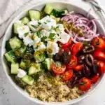 Colorful Mediterranean quinoa bowl with fluffy quinoa and fresh vegetables.