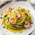 Garlic butter shrimp with zucchini noodles in a vibrant close up food photo