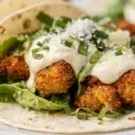 Crispy smash chicken Caesar tacos recipe in close up food photo