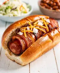 BBQ Bacon Wrapped Hot Dogs with glossy caramelized glaze.