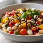 Vibrant Caprese Pasta Salad with cherry tomatoes and mozzarella