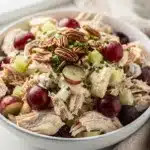 Creamy chicken salad croissant with grapes and pecans