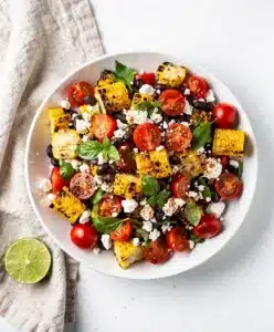 Grilled Corn Salad Patriotic with cherry tomatoes and feta.