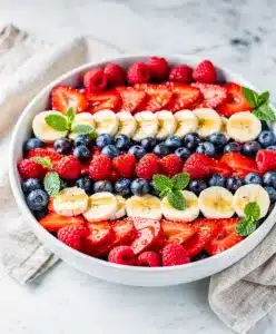 Patriotic fruit salad with honey lime poppy seed dressing